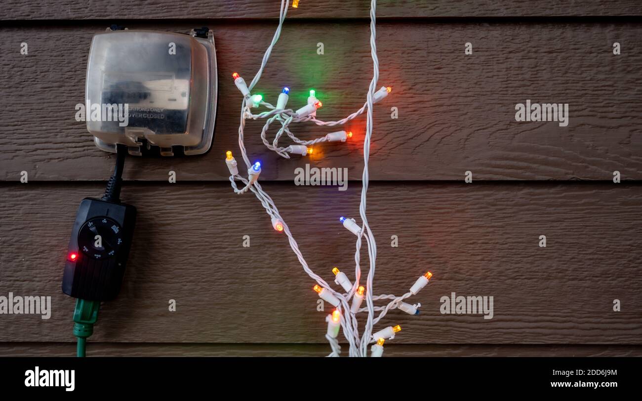 Outdoor setup and installation of Christmas decorations using a timer ...