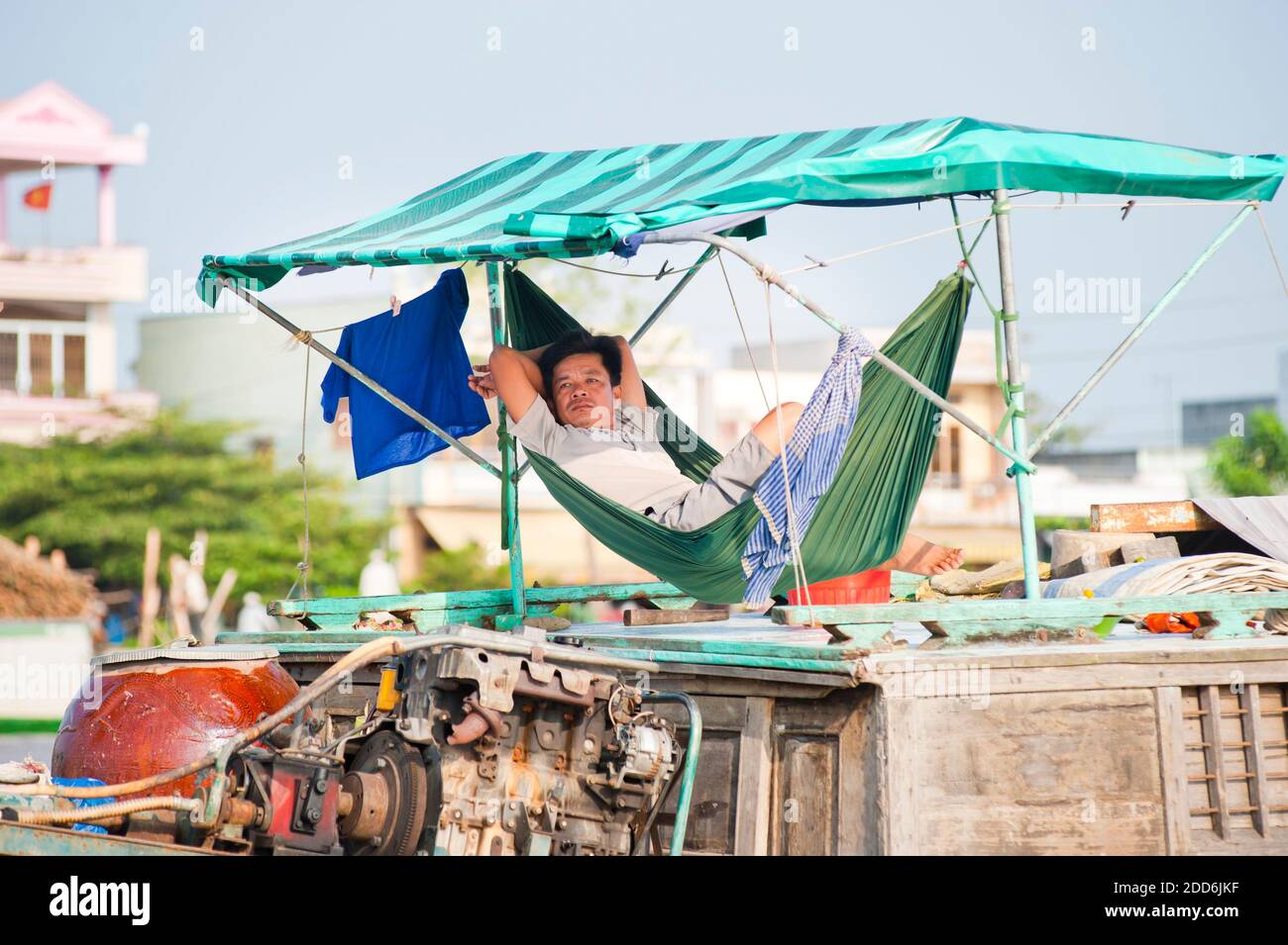 Man Sleeping in a Hammock on his Boat at Can Tho Floating Market ...