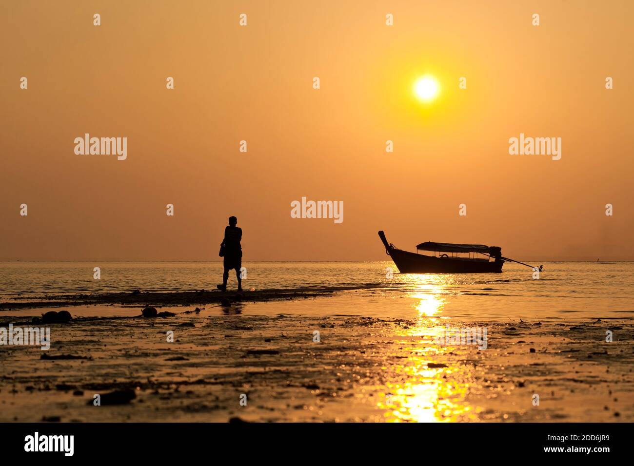 Silhouetted Tourist Arriving at Tropical East Railay Beach, a Popular Tourist Spot in South Thailand, Southeast Asia Stock Photo