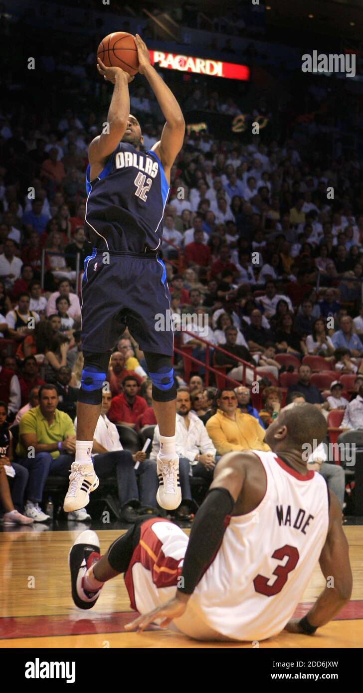 NO FILM, NO VIDEO, NO TV, NO DOCUMENTARY - Dallas Mavericks' Jerry Stackhouse takes a jump shot as Miami Heat's Dwyane Wade watches in the second half at the American Airlines Center in Miami, FL, USA on January 21, 2007. The Mavericks defeated the Heat 99-93. Photo by Charles Trainor Jr./Miami Herald/MCT/Cameleon/ABACAPRESS.COM Stock Photo