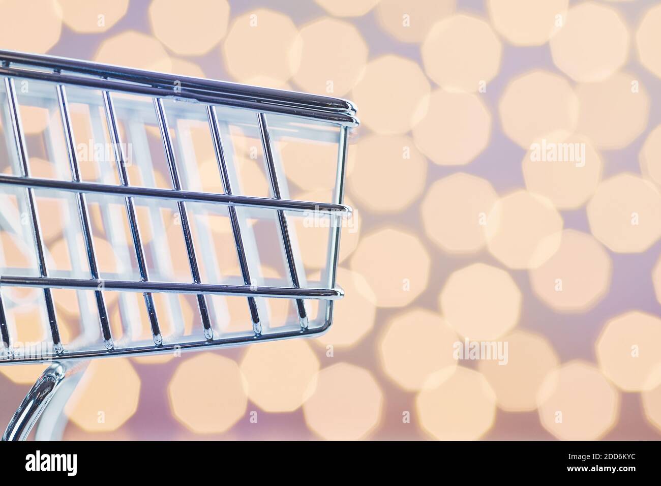 Close up picture of an empty shopping cart, color toned conceptual picture, selective focus. Stock Photo