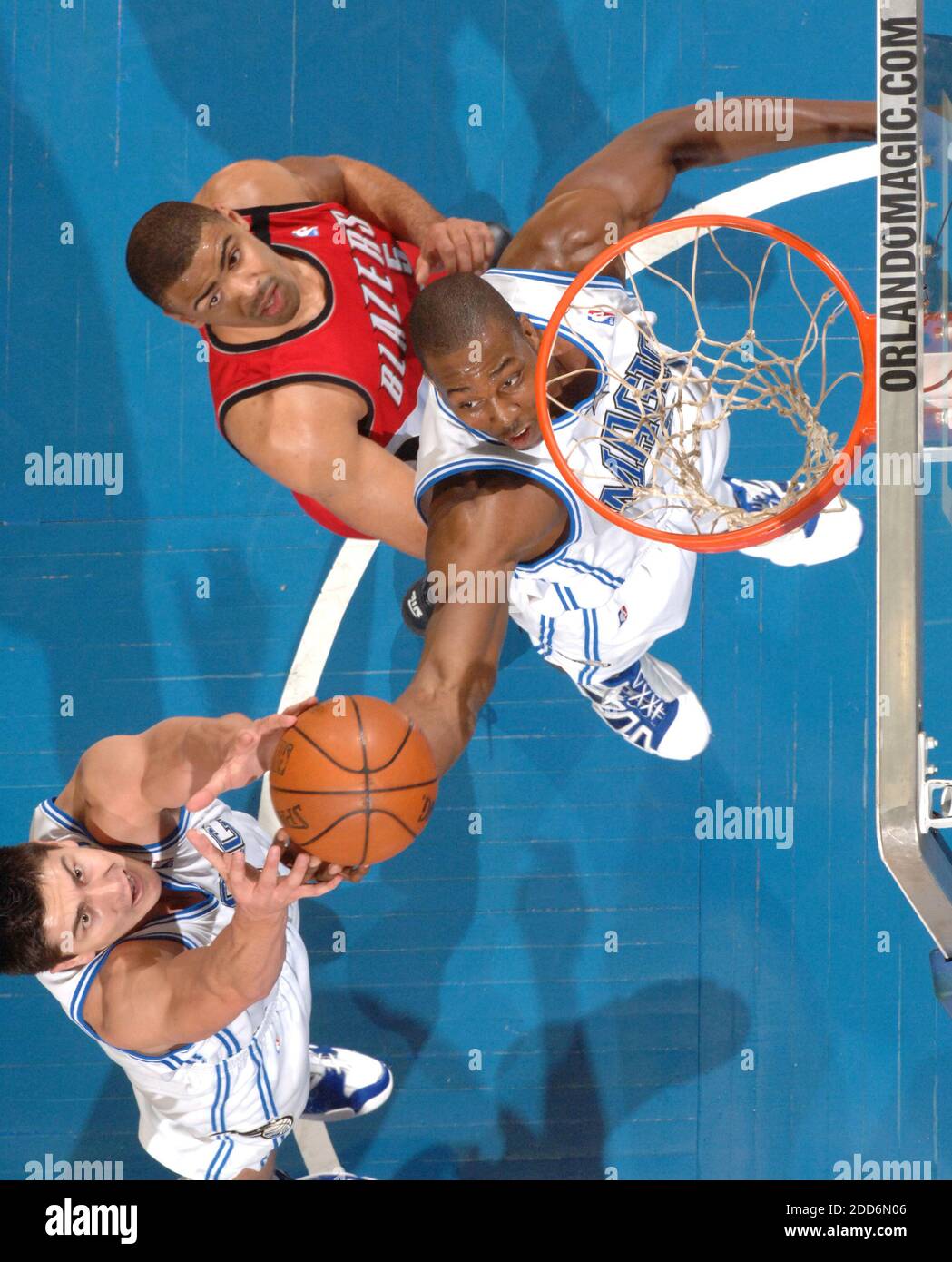 NO FILM, NO VIDEO, NO TV, NO DOCUMENTARY - Orlando Magic's Dwight Howard and Darko Milicic (left) battle for a rebound over Portland Trailblazers' Ime Udoka during the Magic's 103-91 victory over the Trailblazers at Amway Arena in Orlando, FL, USA on February 14, 2007. Orlando won 103-91. Photo by Gary W. Green/Orlando Sentinel/MCT/Cameleon/ABACAPRESS.COM Stock Photo