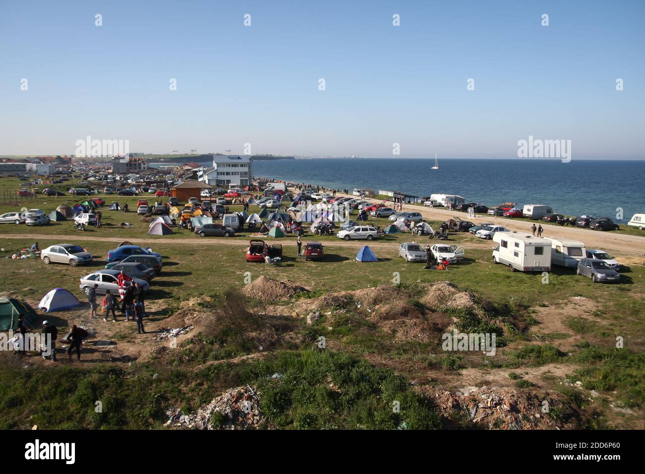 Vama Veche, Romania - May 1, 2010: Overview of the Vama Veche village with tents and people partying during the 1 May holiday. Stock Photo