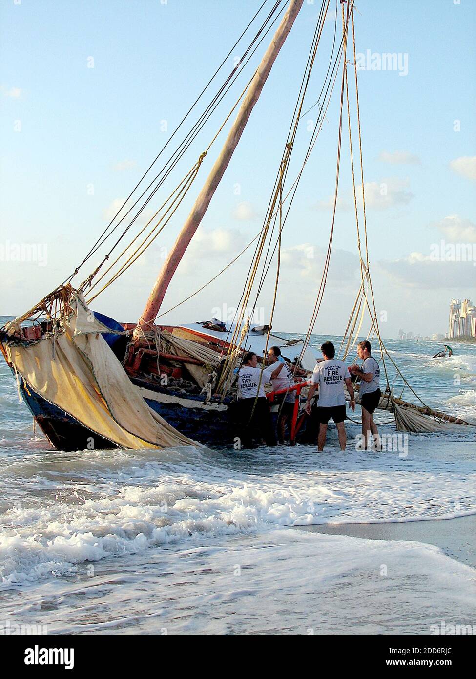 NO FILM, NO VIDEO, NO TV, NO DOCUMENTARY - More than 100 famished Haitian migrants slogged through waves and staggered ashore after their flimsy wooden sailboat ran aground in Hallandale Beach, Florida, Wednesday, March 28, 2007. Photo by David Santiago/El Nuevo Herald/MCT/ABACAPRESS.COM Stock Photo