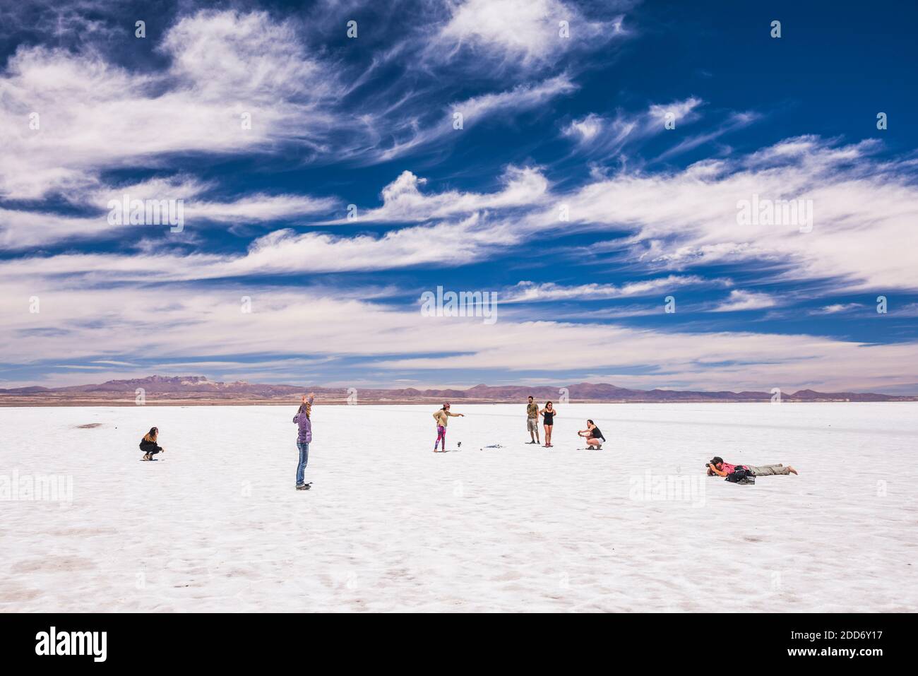 Taking perspective photos at Uyuni Salt Flats (Salar de Uyuni), Uyuni, Bolivia, South America Stock Photo