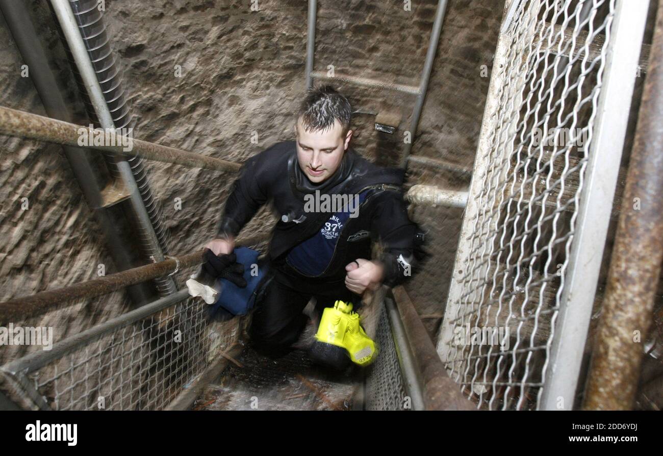 NO FILM, NO VIDEO, NO TV, NO DOCUMENTARY - Diver Matt Nance of the Sedgwick County Fire Department, carries his gear out from the bottom of the world's largest hand dug well on Tuesday, May 8, 2007, in Greensburg, KS, USA. Divers searched the bottom of the well for victims of Friday's tornado. Photo by Travis Heying/Wichita Eagle/MCT/ABACAPRESS.COM Stock Photo