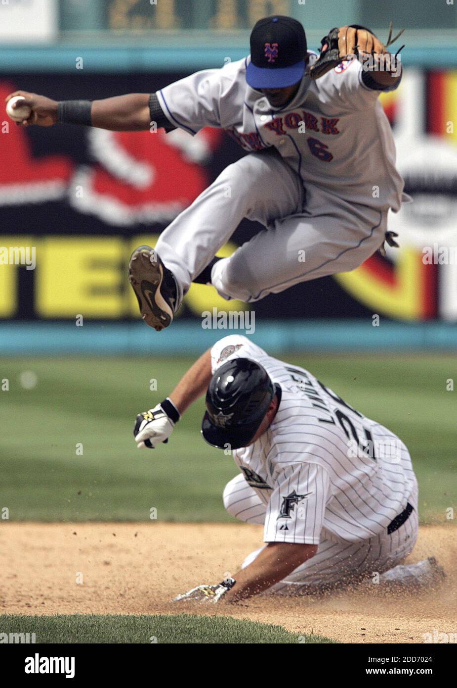 NO FILM, NO VIDEO, NO TV, NO DOCUMENTARY - New York Mets second baseman Ruben Gotay leaps over the Florida Marlins' Todd Linden to complete a double play. The Mets defeated the Marlins, 6-4, at Dolphin Stadium in Miami, FL, USA on May 27, 2007. Photo by Carl Juste/Miami Herald/MCT/Cameleon/ABACAPRESS.COM Stock Photo