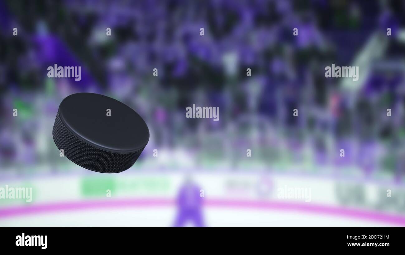 Hockey puck in the air. The crowd of fans on a blurred background. Sport games Stock Photo