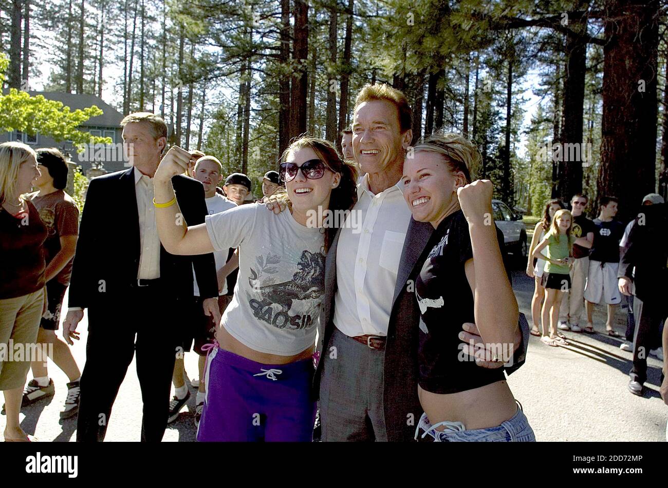 NO FILM, NO VIDEO, NO TV, NO DOCUMENTARY - California Gov. Arnold Schwarzenegger embraces by Morgan Quintana, 16, and Dena Millpointer, 17, (right) of Contra Costa during his visit to Camp Richardson in South Lake Tahoe, CA, USA, on July 2, 2007. The governor asked people not to stay away from vacationing in South Lake Tahoe for the holiday week. Photo by Jose Luis Villegas/Sacramento Bee/MCT/ABACAPRESS.COM Stock Photo
