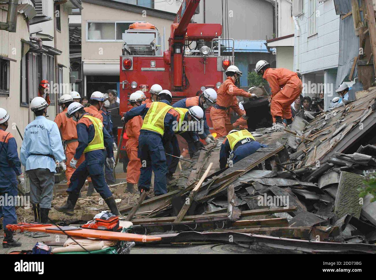 NO FILM, NO VIDEO, NO TV, NO DOCUMENTARY - Rescue workers sift through rubble on Tuesday, July 17, 2007, in Niigata, Japan. An earthquake hit the the area on Monday morning. Photo by Yomiuri Shimbun/MCT/ABACAPRESS.COM Stock Photo