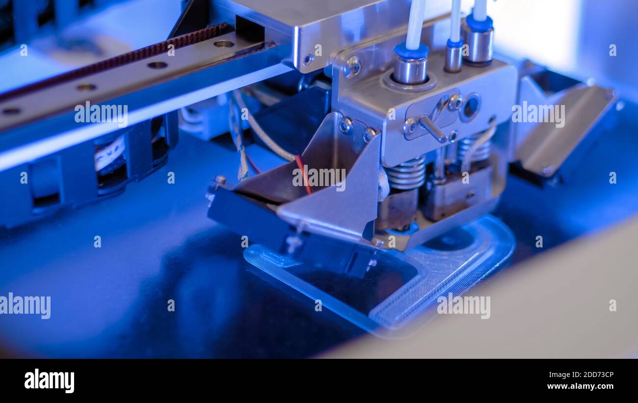 Three dimensional printing machine prints physical 3D model - close up Stock Photo