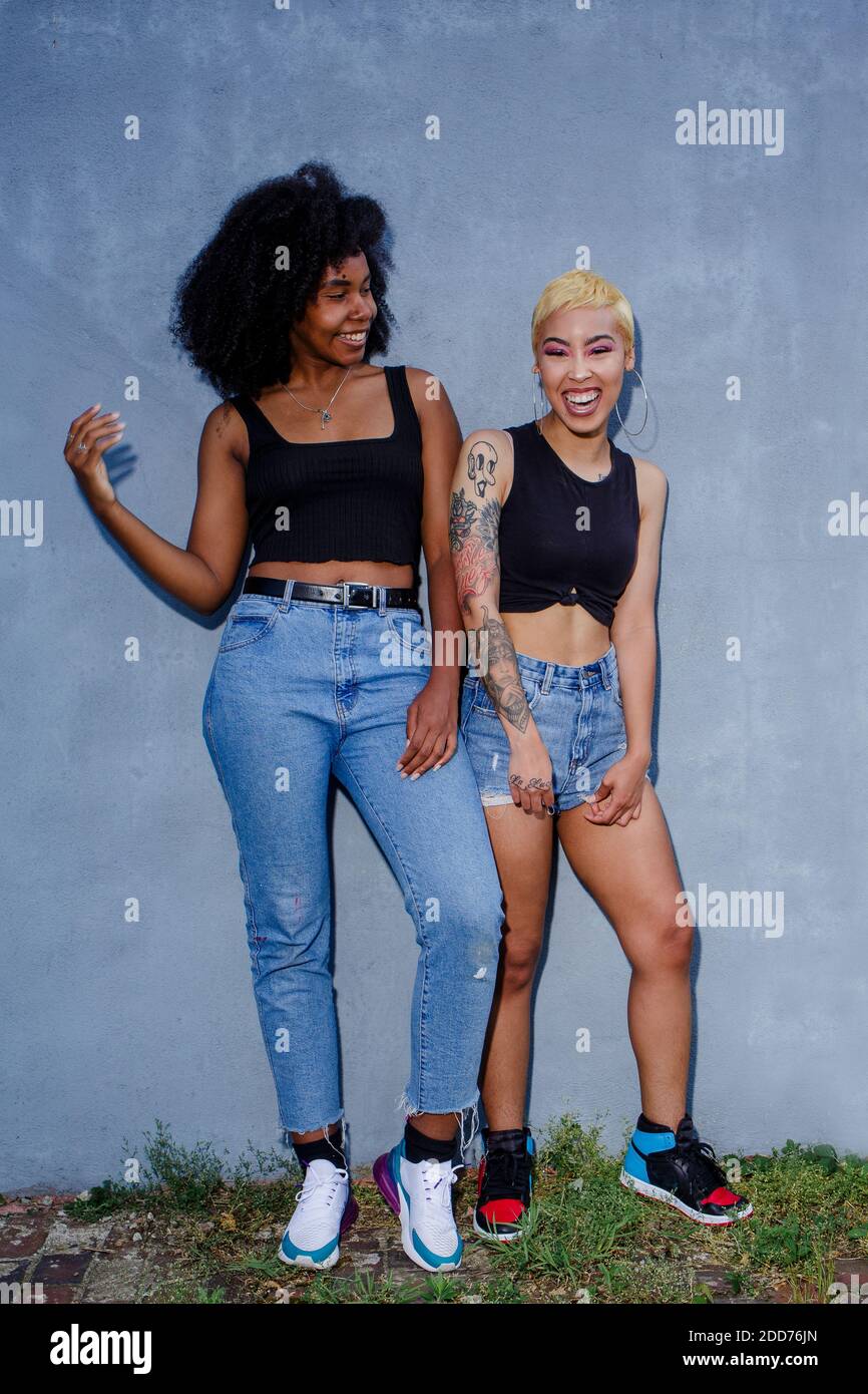 Two women standing together hi-res stock photography and images - Alamy