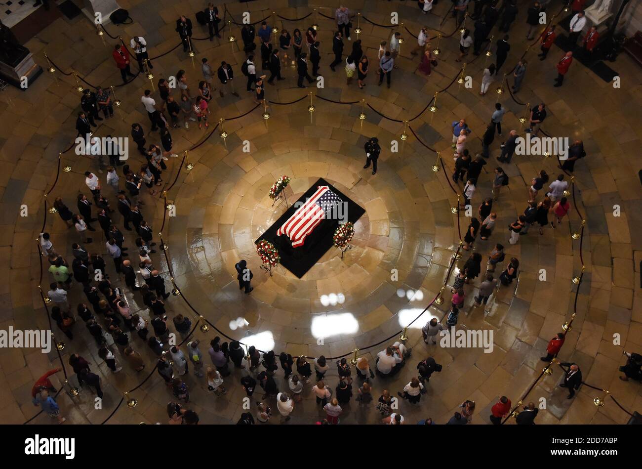 Visitors pay their respects near the casket of the late U.S. Sen. John