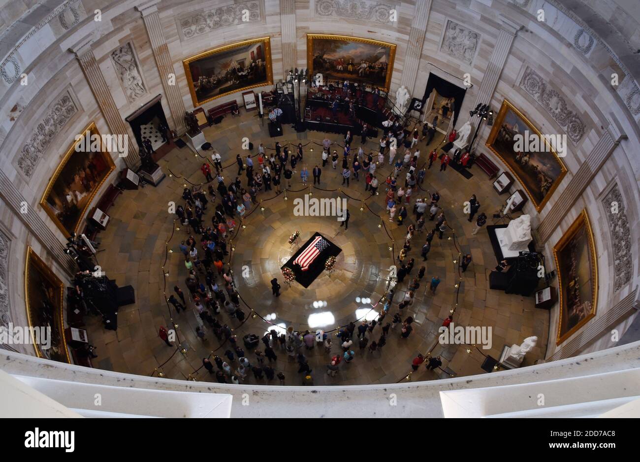 Visitors pay their respects near the casket of the late U.S. Sen. John