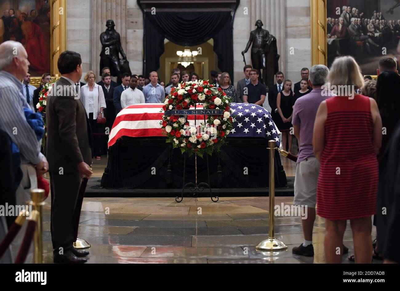 Visitors pay their respects near the casket of the late U.S. Sen. John