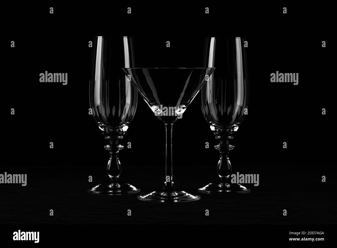 B&W Low-Key Fine Art with 3 glasses against a black velvet backdrop Stock Photo