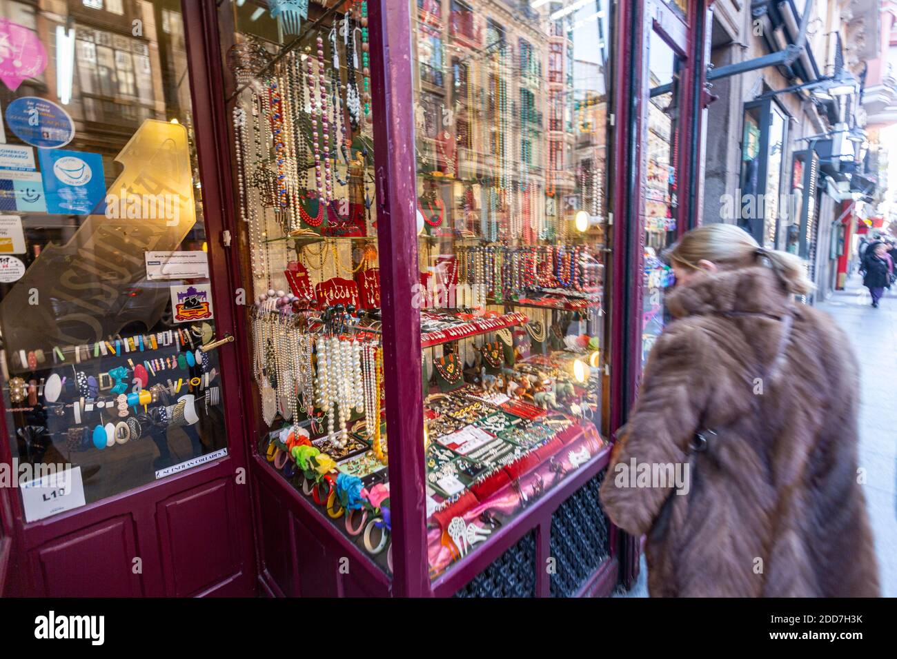 Woman looking the traditional imitation jewellery shop Bisutería Otero in  Calle Mayor, Madrid, Spain Stock Photo - Alamy