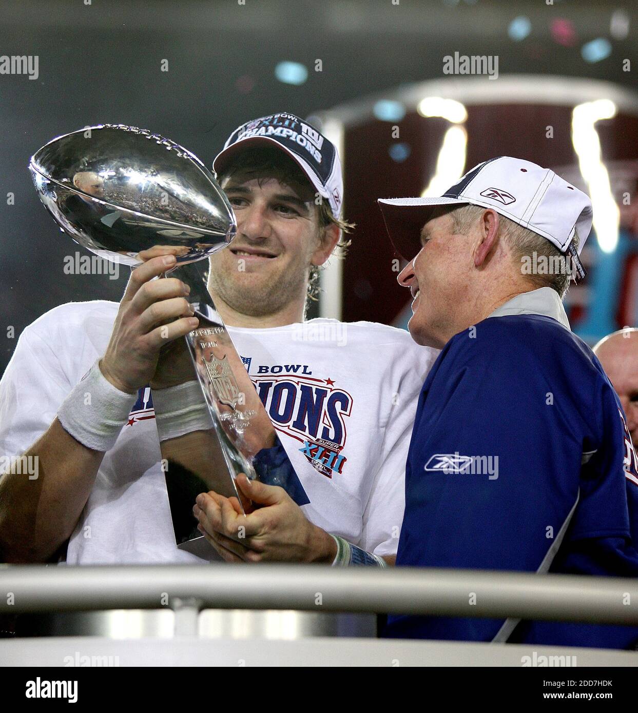 The New York Giants' quarterback Eli Manning and coach Tom Coughlin hold the Lombardi Trophy after a 17-14 Giants' victory in Super Bowl XLII at University of Phoenix Stadium in Glendale, AZ, USA on February 3, 2008.  The NY Giants won 17-14. Photo by Gary W. Green/MCT/Cameleon/ABACAPRESS.COM Stock Photo