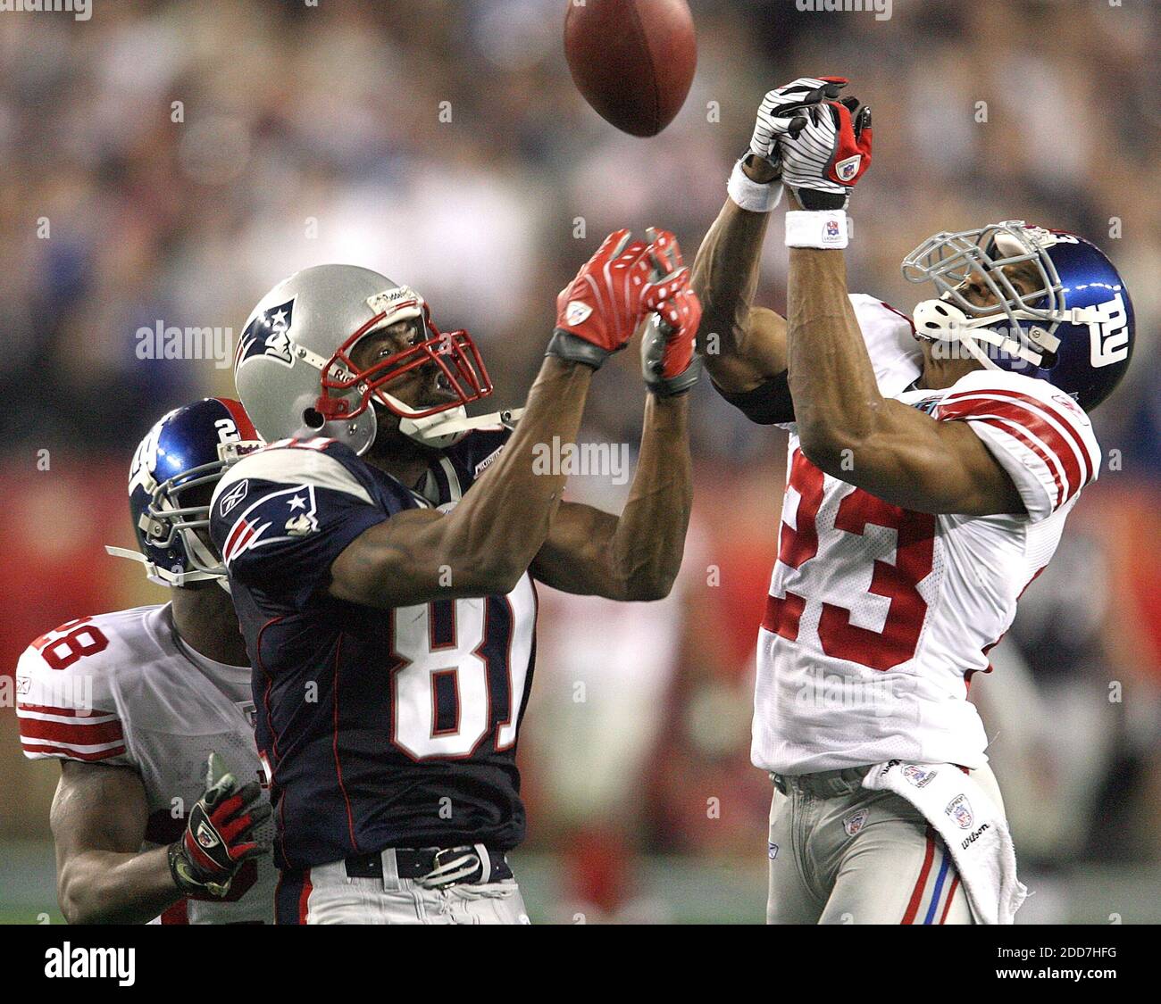 The New England Patriots' Randy Moss (81) can't pull in a pass against the  New York Giants' Corey Webster (23) in a 17-14 Giants victory in Super Bowl  XLII at University of
