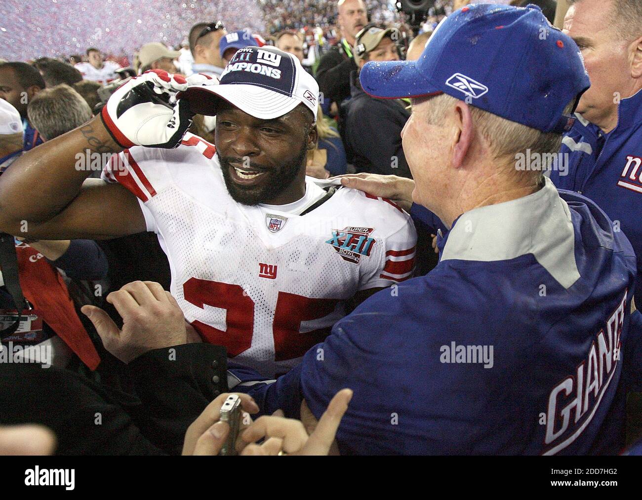 The New York Giants' head coach Tom Coughlin, right, and R.W. McQuarters celebrate after a 17-14 Giants' victory in Super Bowl XLII at University of Phoenix Stadium in Glendale, AZ, USA on February 3, 2008.  The NY Giants won 17-14. Photo by Gary W. Green/MCT/Cameleon/ABACAPRESS.COM Stock Photo