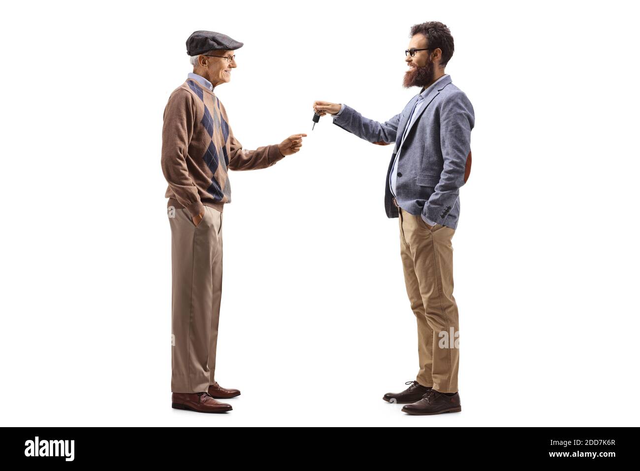 Bearded man giving car keys to an elderly man isolated on white background Stock Photo