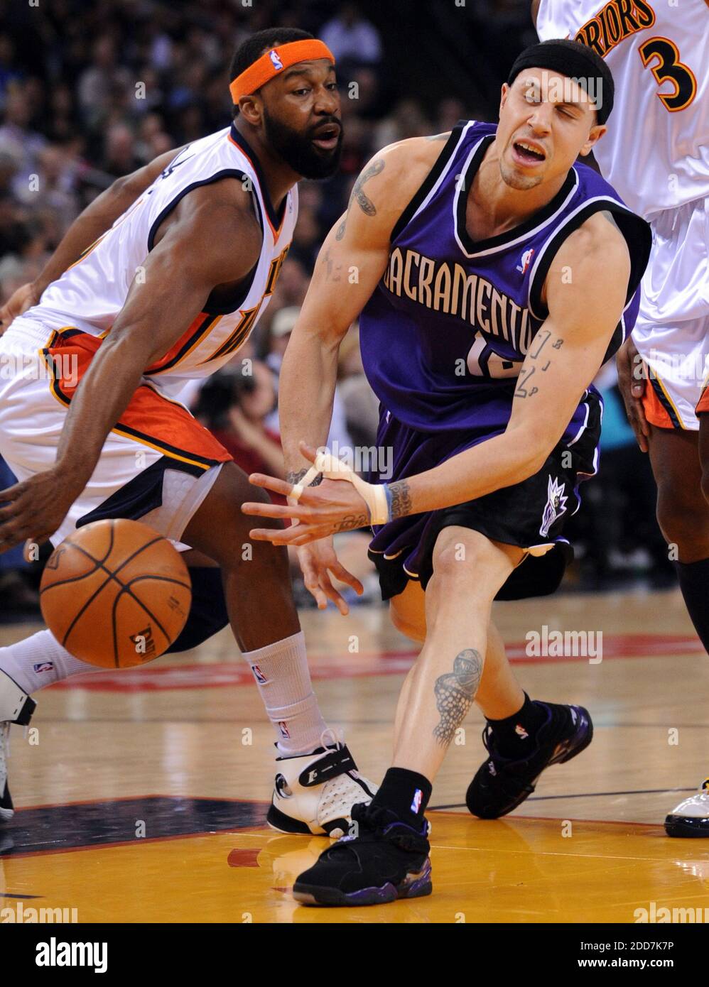 Mike Bibby drives Derek fisher in the first quarter in game four