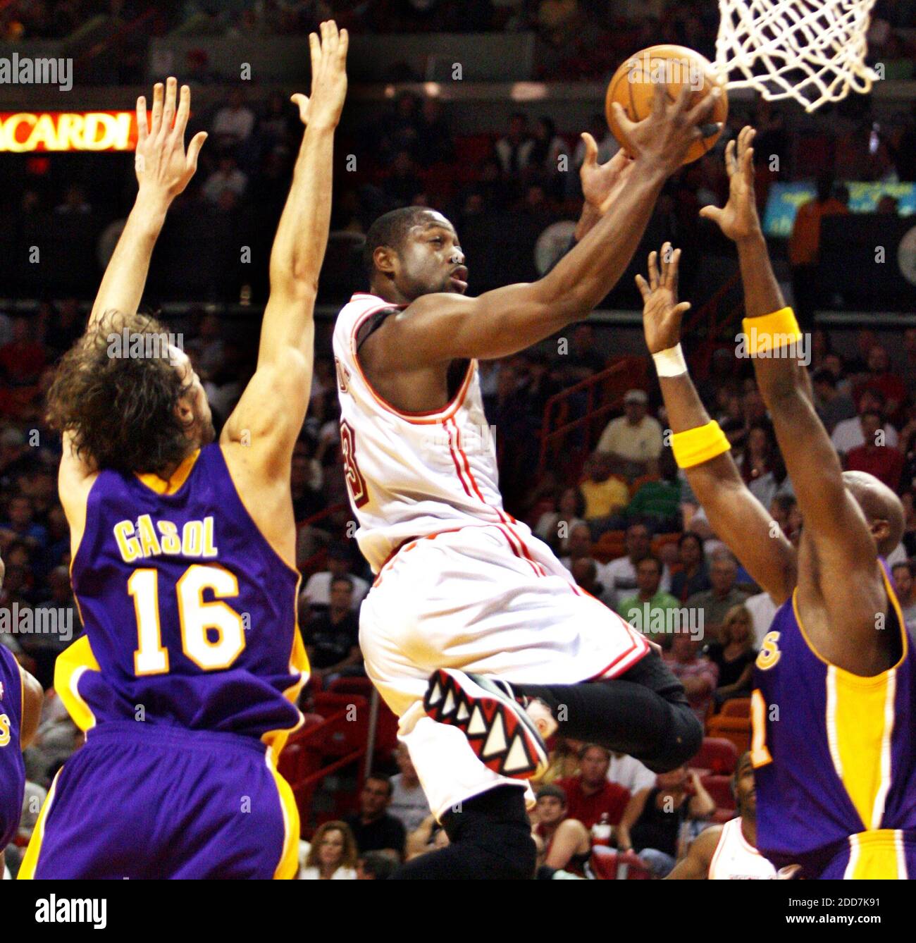 Miami Heat's Dwyane Wade drives and scores on Los Angeles Lakers Pau Gasol (left) and Lamar Odom during second quarter action at the American Airlines Arena in Miami, FL, USA on February 10, 2008. Los Angeles Lakers won the game 104-94. Photo by Jeffrey M. Boan/El Nuevo Herald/MCT/Cameleon/ABACAPRESS.COM Stock Photo