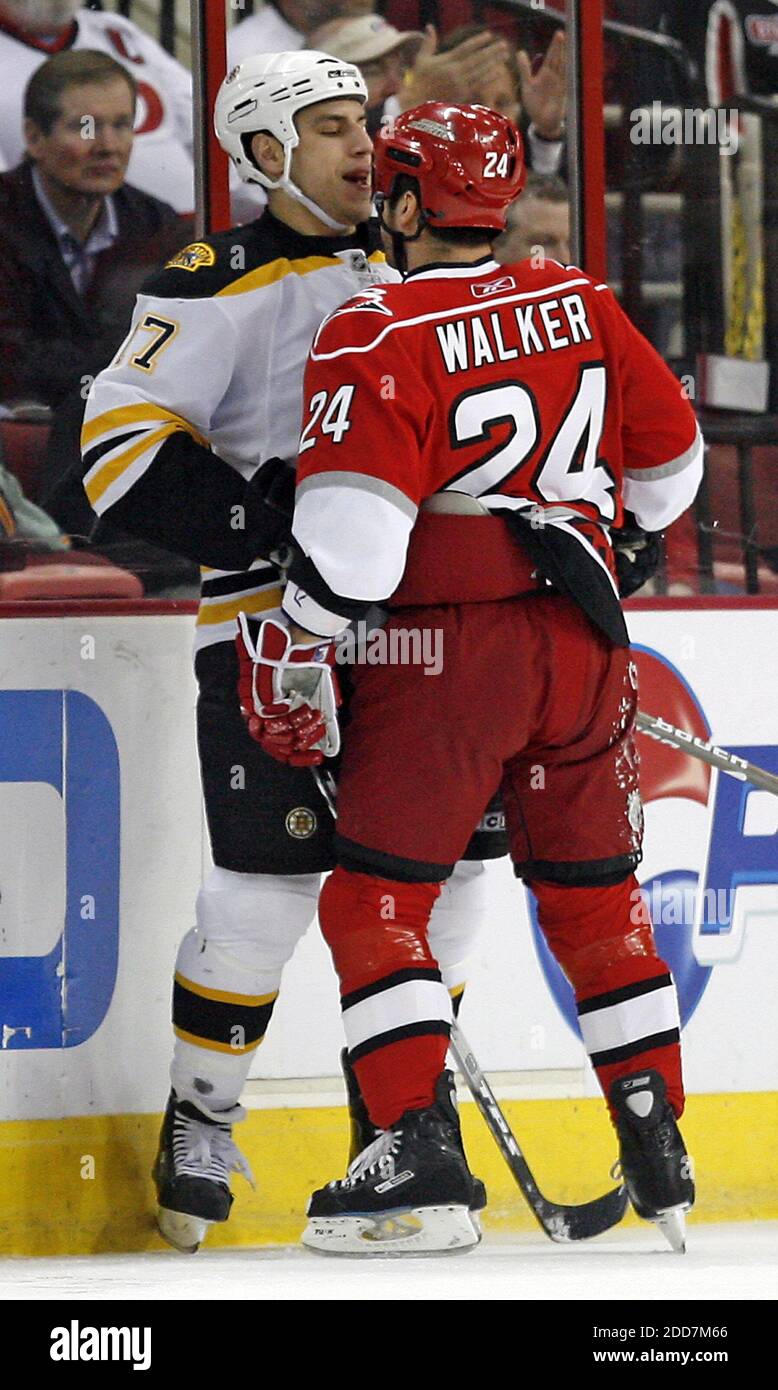 The Carolina Hurricanes' Scott Walker (24) gets in the face of the Boston Bruins' Milan Lucic (17) during first period action at the RBC Center in Raleigh, NC, USA on February 19, 2008. The Bruins defeated the Hurricanes in overtime, 3-2. Photo by Chris Seward/Raleigh News & Observer/MCT/Cameleon/ABACAPRESS.COM Stock Photo