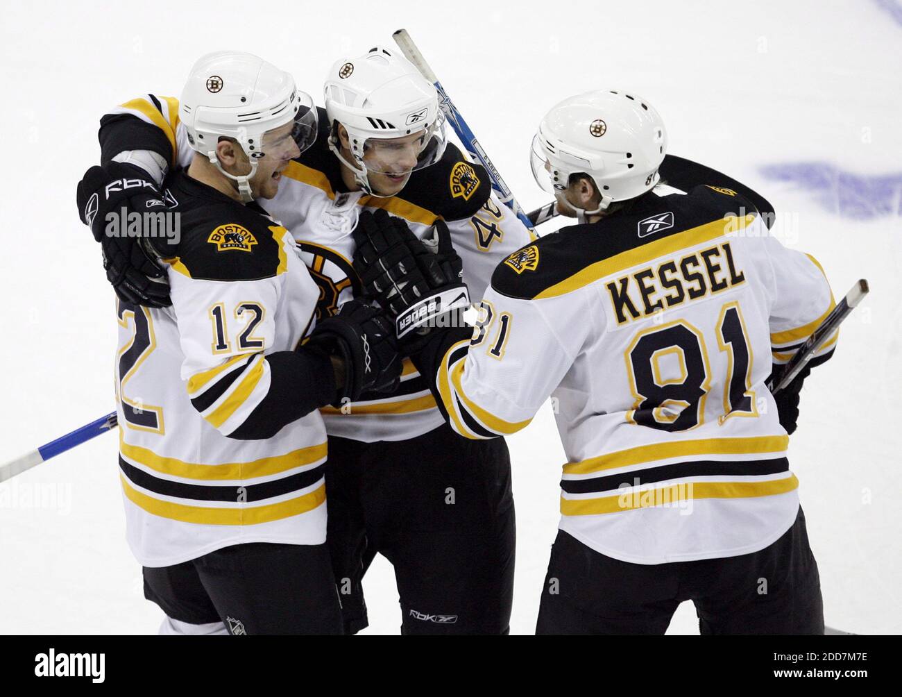 The Boston Bruins' David Krejci (46) gets congratulated by teammates Chuck Kobasew (12) and Phil Kessel (81) after he scored the final goal in the overtime shootout against the Carolina Hurricanes at the RBC Center in Raleigh, NC, USA on February 19, 2008. The Bruins defeated the Hurricanes in overtime, 3-2. Photo by Chris Seward/Raleigh News & Observer/MCT/Cameleon/ABACAPRESS.COM Stock Photo