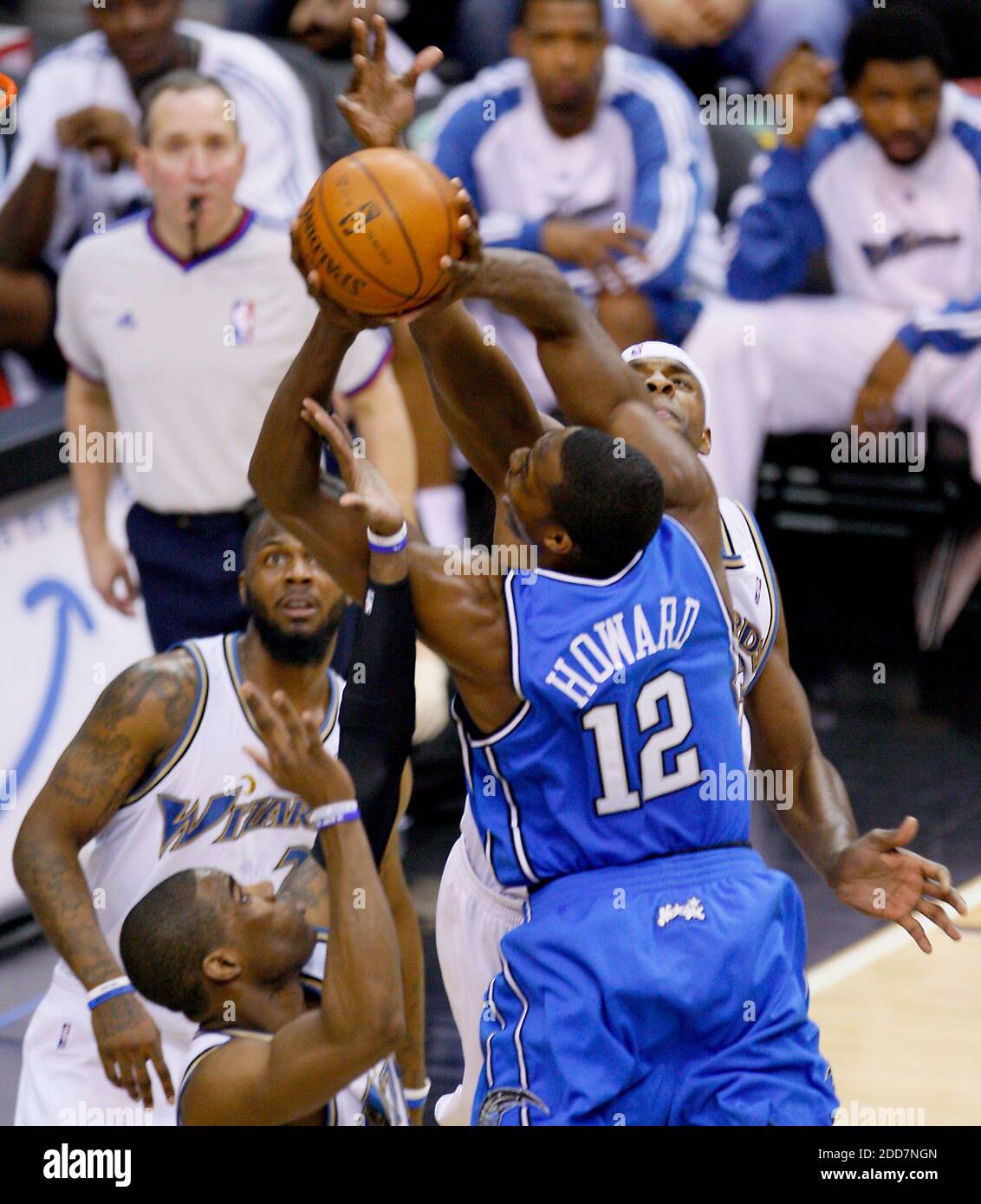 NO FILM, NO VIDEO, NO TV, NO DOCUMENTARY - Orlando Magic's Dwight Howard  (12) drives to the basket in heavy traffic against the Washington Wizards  Antawn Jamison (left), DeShawn Stevenson (background) and