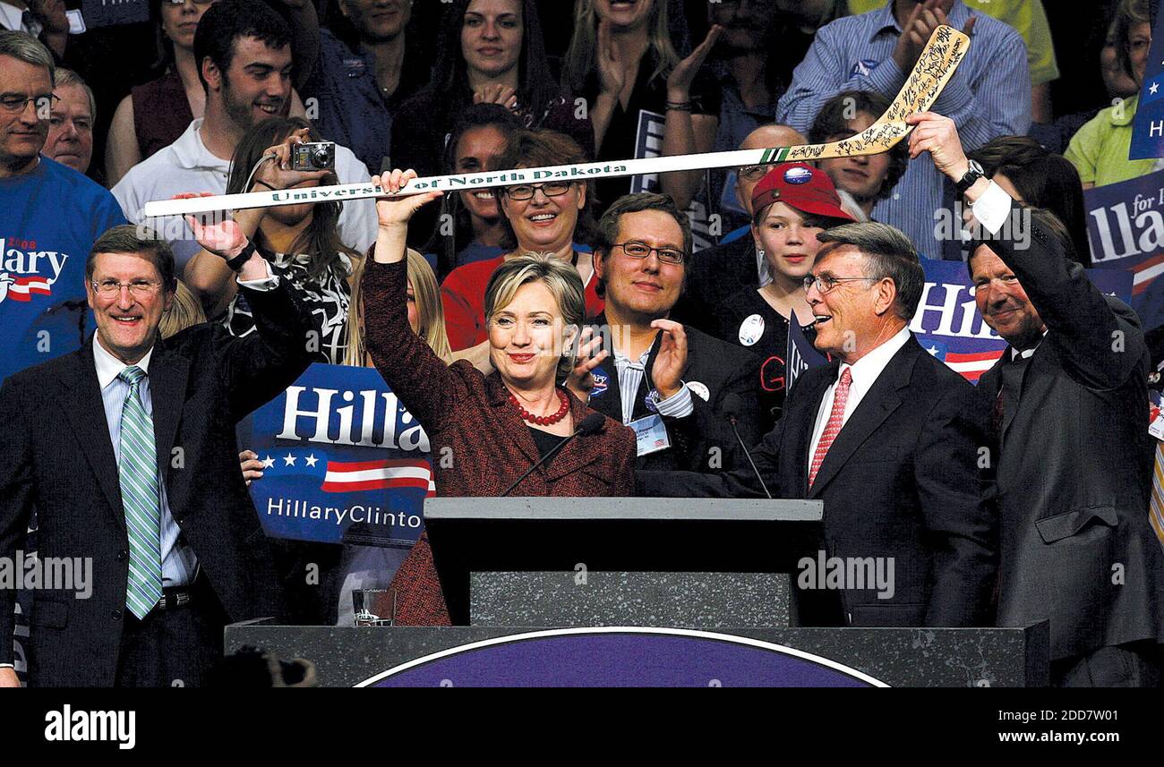 NO FILM, NO VIDEO, NO TV, NO DOCUMENTARY - North Dakota Senator Kent Conrad (L), North Dakota Senator Bryon Dorgan and North Dakota Congressman Earl Pomeroy (R) join the stage with Democratic presidential hopeful Senator Hillary Rodham Clinton (C) holds up a hockey stick from the University of North Dakota's hockey team at the North Dakota Democratic-NPL Convention in Grand Forks, ND, USA, on April 04, 2008. Photo by Jackie Lorentz/Grand Forks Herald/MCT/ABACAPRESS.COM Stock Photo