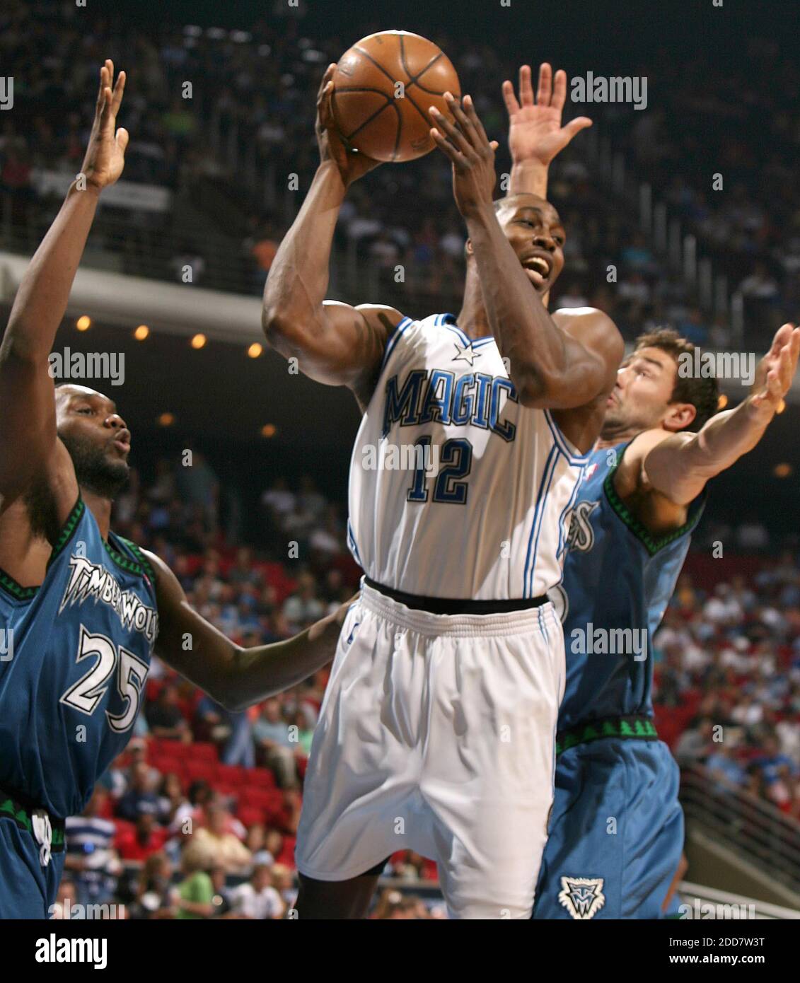NO FILM, NO VIDEO, NO TV, NO DOCUMENTARY - Orlando Magic center Dwight Howard handles the ball among Minnesota Timberwolves defenders including center Al Jefferson, left, at Amway Arena in Orlando, FL, USA on April 11, 2008. Photo by Stephen M. Dowell/Orlando Sentinel/MCT/Cameleon/ABACAPRESS.COM Stock Photo