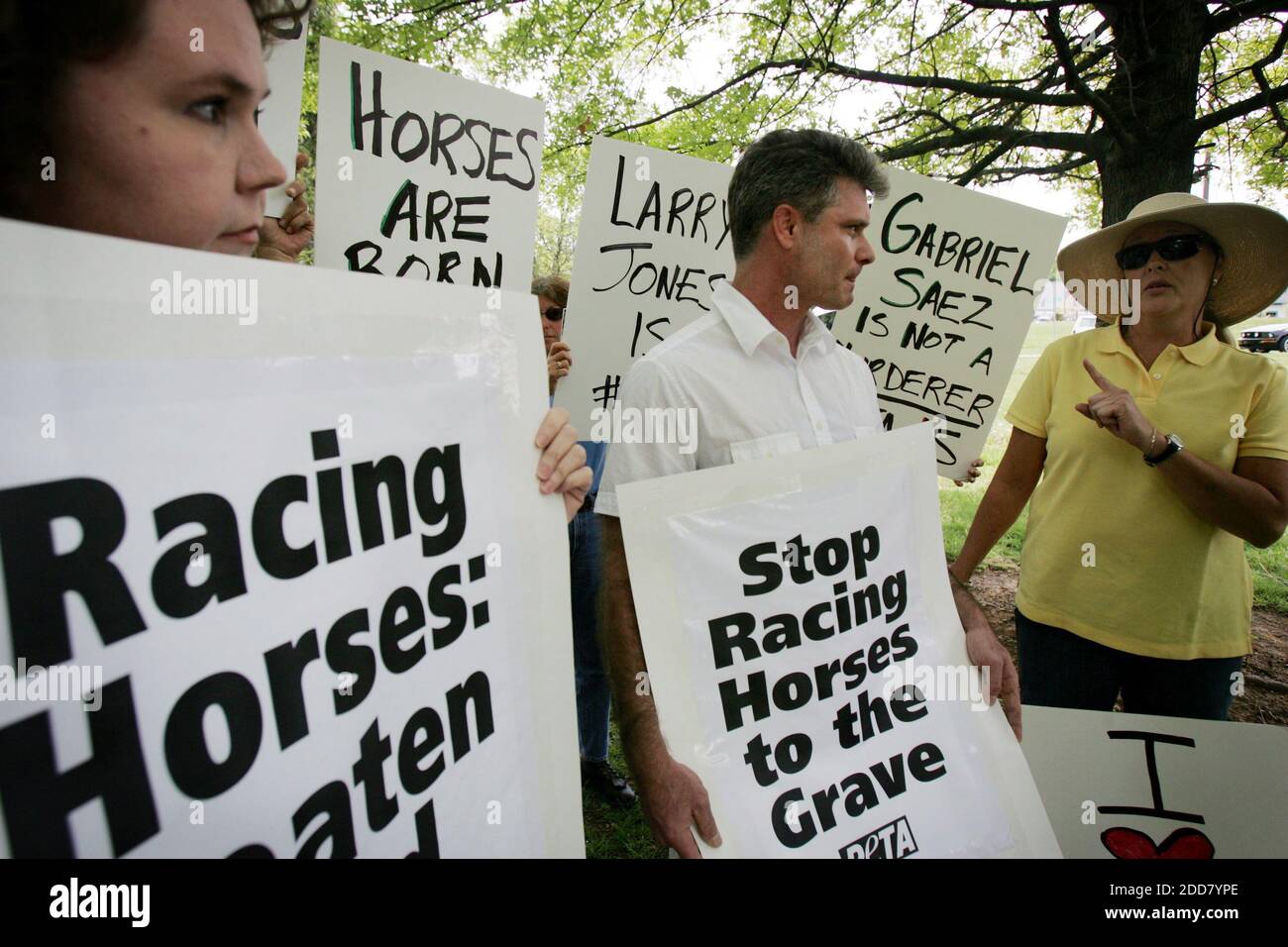 NO FILM, NO VIDEO, NO TV, NO DOCUMENTARY - Kelli O'Brien, left, and Tom Crain, protesters, and Laura Koester, right, supporter, argue during a protest at the Kentucky Horse Racing Authority's headquarters in Lexington, KY, USA on May 6, 2008. PETA has urged the suspension of jockey Gabriel Saez for what it viewed as excessive whipping of Eight Belles during the Kentucky Derby. Photo by Jenn Ackerman/Lexington Herald-Leader/MCT/ABACAPRESS.COM Stock Photo