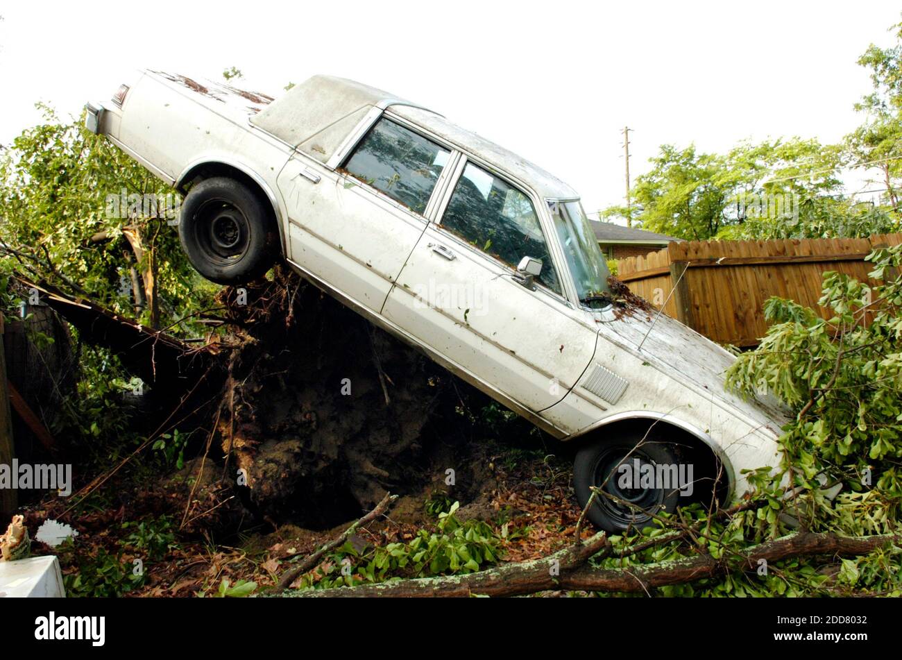 NO FILM, NO VIDEO, NO TV, NO DOCUMENTARY - The rear of a car was lifted ...