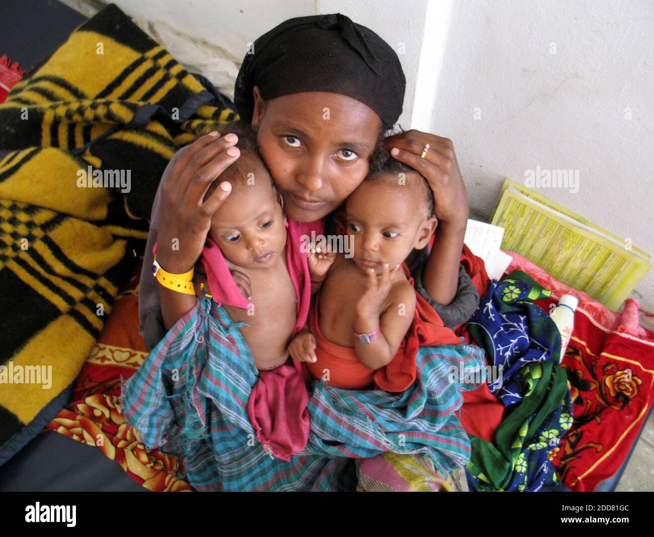 NO FILM, NO VIDEO, NO TV, NO DOCUMENTARY - Bedatu Habiba cradles her 6-month-old twins, both suffering from severe malnutrition, at a clinic in Shashemene, Ethiopia, May 28, 2008. In the poor farming villages around Shashemene, in drought-ravaged southern Ethiopia, aid workers believe that hundreds and perhaps thousands more children are starving. Photo by Shashank Bengali/MCT/ABACAPRESS.COM Stock Photo