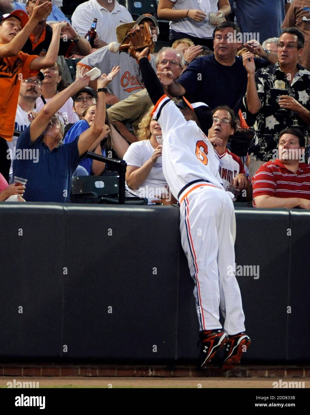 The Baltimore Orioles' Melvin Mora can't catch a foul pop as he dives into the stands on a ball hit by the Toronto Blue Jays' Matt Stairs in the fourth inning at Oriole Park at Camden Yards in Baltimore, MD, USA on July 23, 2008. Photo by Lloyd Fox/Baltimore Sun/MCT/Cameleon/ABACAPRESS.COM Stock Photo