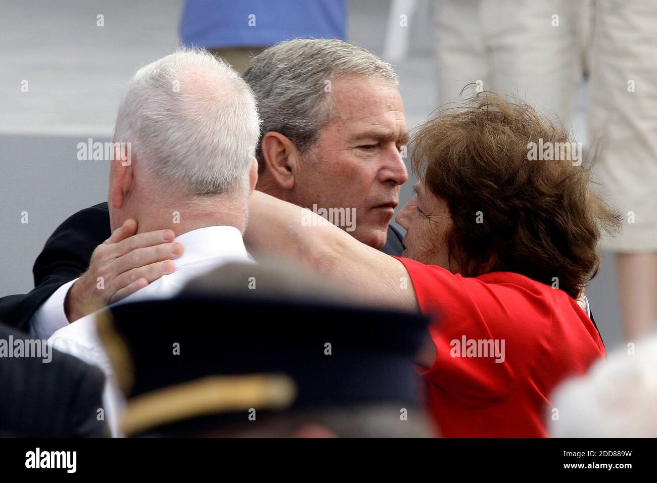 NO FILM, NO VIDEO, NO TV, NO DOCUMENTARY - President George W. Bush hugs people in the audience during the Pentagon ceremony marking the seventh anniversary of the attacks of September 2001, on September 11, 2008. Photo by Chuck Kennedy/MCT/ABACAPRESS.COM Stock Photo