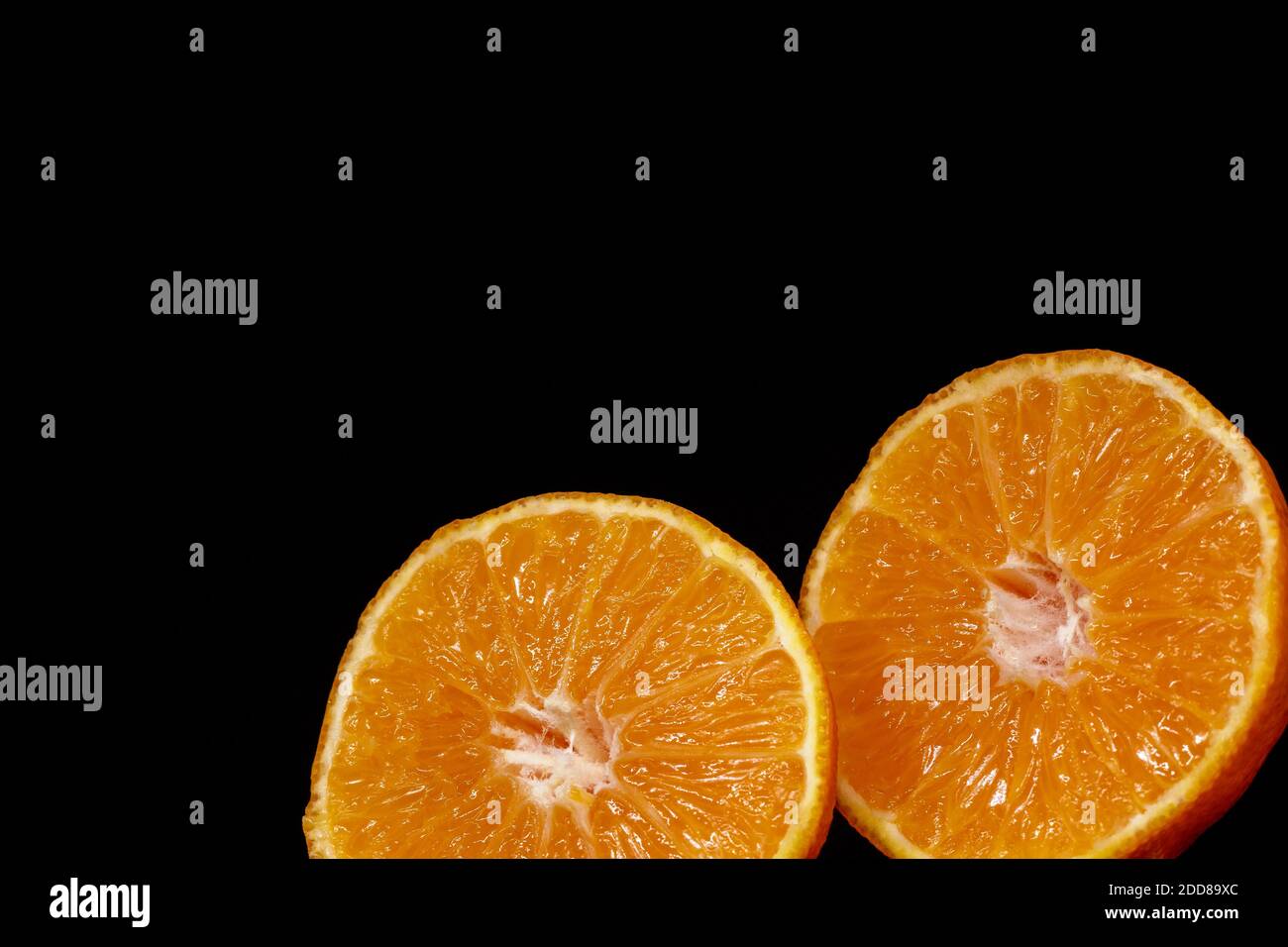 Tangerine cut in half, ideal for a healthy and genuine background Stock