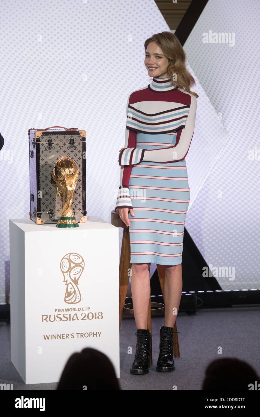 Russian model Natalia Vodianova poses with the FIFA Russia 2018 World Cup  trophy during the presentation of its official case which will be used to  carry it, at the Louis Vuitton headquarters