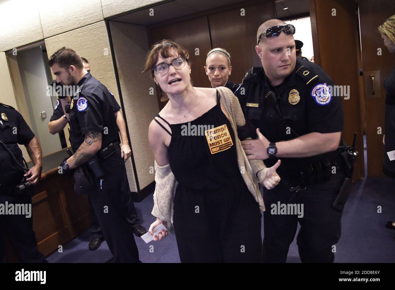 A protester is escorted outside of the Brett Kavanaugh confirmation hearing in the Hart Senate Office Building on Friday, Sept. 7, 2018. Photo by Olivier Douliery/ Abaca Press Stock Photo
