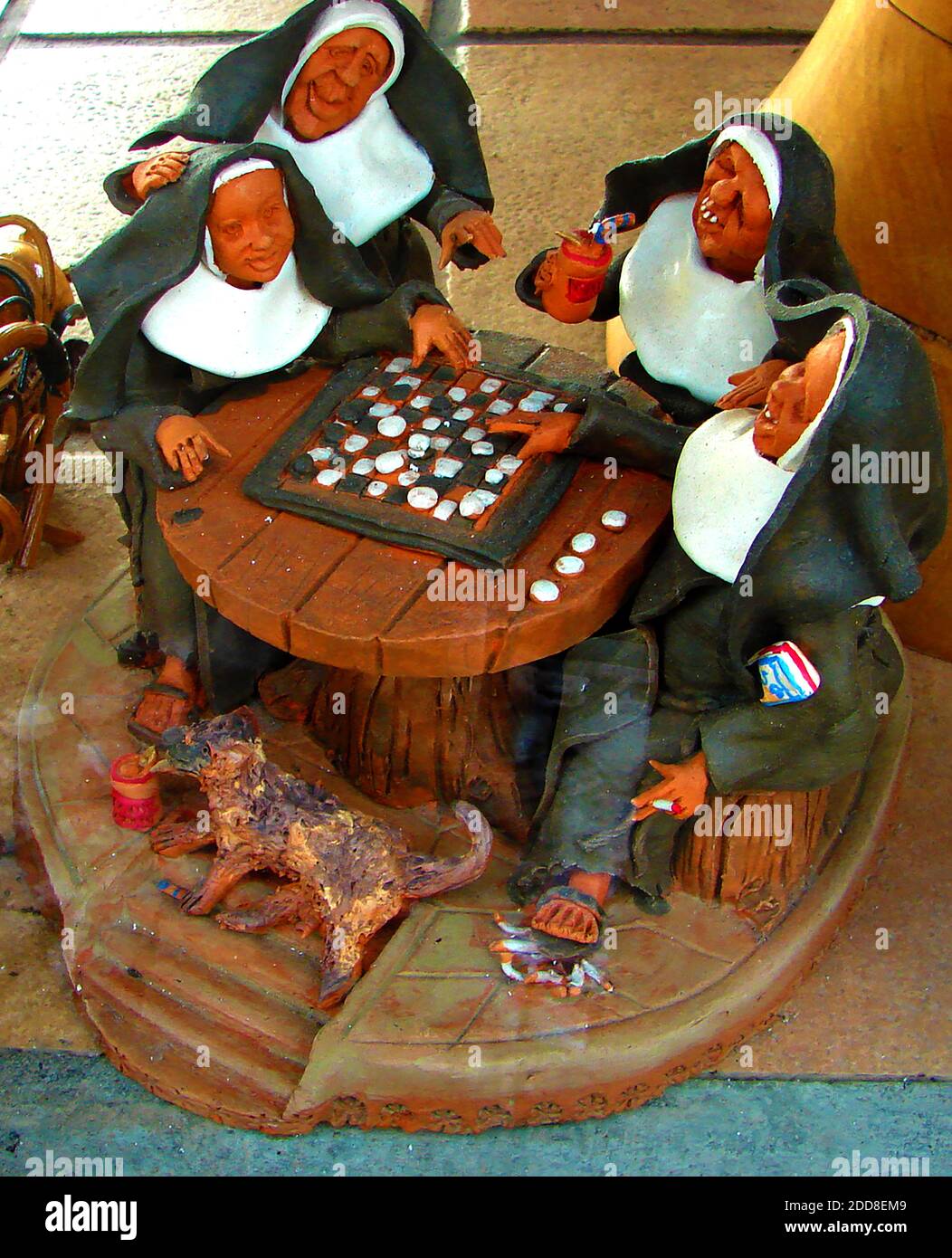 Madeira 2007 - Irreverent religious miniature hand made sculpture depicting a group of nuns playing draughts Stock Photo