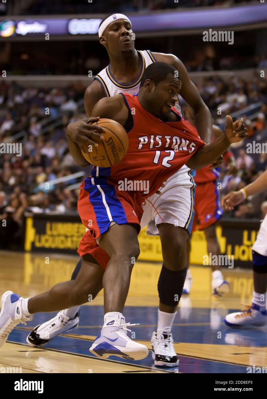 NO FILM, NO VIDEO, NO TV, NO DOCUMENTARY - Will Bynum (12) of the Detroit Pistons is fouled by Andray Blatche (32) of the Washington Wizards as he drives to the basket in the first half of their game at the Verizon Center in Washington, DC, USA on December 9, 2008. Washington Wizards won 107-94. Photo by George Bridges/MCT/Cameleon/ABACAPRESS.COM Stock Photo