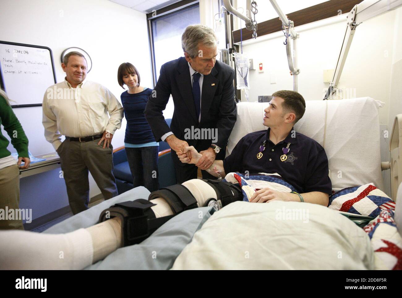 NO FILM, NO VIDEO, NO TV, NO DOCUMENTARY - US President George W. Bush shakes hands with U.S. Army Staff Sgt. Kyle Stipp of Avon, Ind., after presenting him with two Purple Hearts, during a visit to Walter Reed Army Medical Center, where the soldier is recovering from wounds suffered in Operation Iraqi Freedom, in Washington, DC, USA on Monday, December 22, 2008. Photo by Eric Draper/White House/MCT/ABACAPRESS.COM Stock Photo