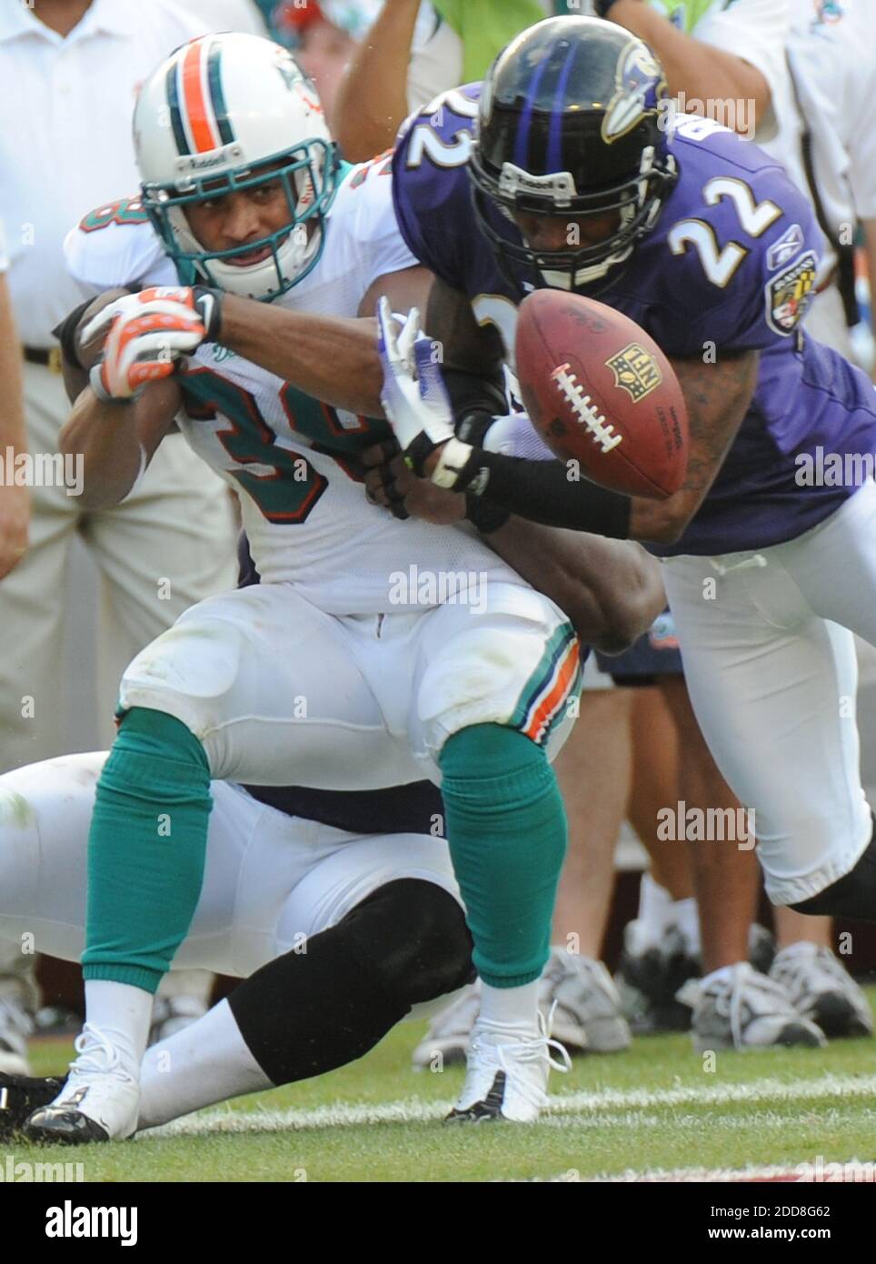 NO FILM, NO VIDEO, NO TV, NO DOCUMENTARY - Miami Dolphins Patrick Cobbs  fumbles the ball after getting hit by Baltimore Ravens Samari Rolle. The  Ravens defeated the Dolphins 27-9 during an