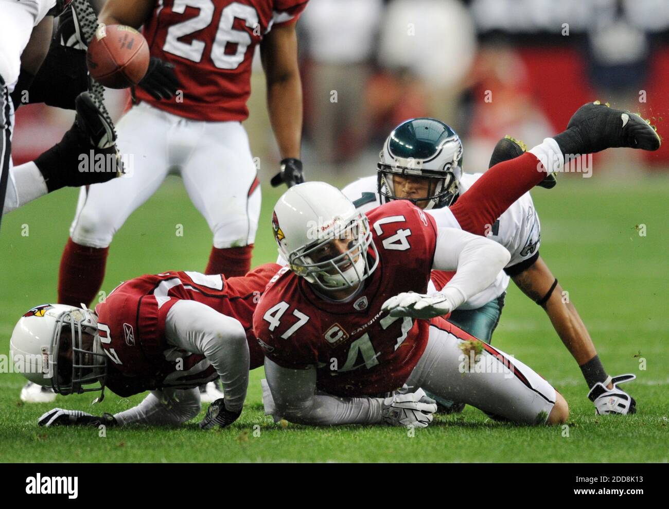 NO FILM, NO VIDEO, NO TV, NO DOCUMENTARY - Arizona Cardinals safety Aaron Francisco (47) fumbles the ball after intercepting a pass by Philadelphia Eagles quarterback Donovan McNabb in the first quarter of the NFC Championship at the University of Phoenix Stadium in Phoenix, AZ, USA on January 18, 2009. The Cardinals defeated the Eagles, 32-25. Photo by Clem Murray/Philadelphia Inquirer/MCT/Cameleon/ABACAPRESS.COM Stock Photo