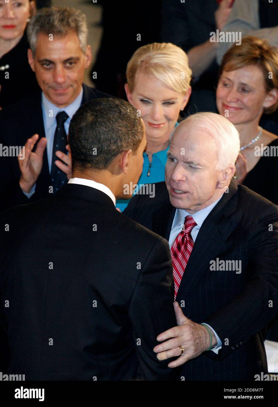 NO FILM, NO VIDEO, NO TV, NO DOCUMENTARY - President Barack Obama, left, greets his former campaign opponent Sen. John McCain (R-AZ.) as Obama's Chief of Staff, Rahm Emmanuel and Cindy McCain look on, in Statutory Hall at the U.S. Capitol in Washington, D.C., USA, on Tuesday, January 20, 2009. Photo by Harry Hamburg/Pool/MCT/ABACAPRESS.COM Stock Photo
