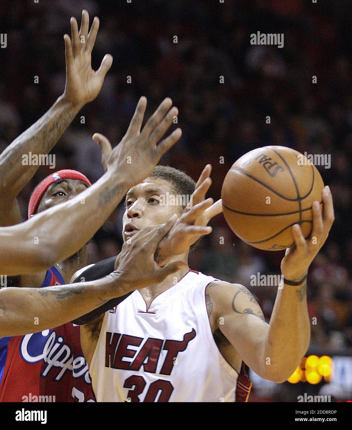 NO FILM, NO VIDEO, NO TV, NO DOCUMENTARY - Miami Heat's Michael Beasley drives to the basket past a group of Los Angeles Clippers defenders including Ricky Davis at the AmericanAirlines Arena in Miami, FL, USA on February 2, 2009. Photo by Patrick Farrell/Miami Herald/MCT/Cameleon/ABACAPRESS.COM Stock Photo