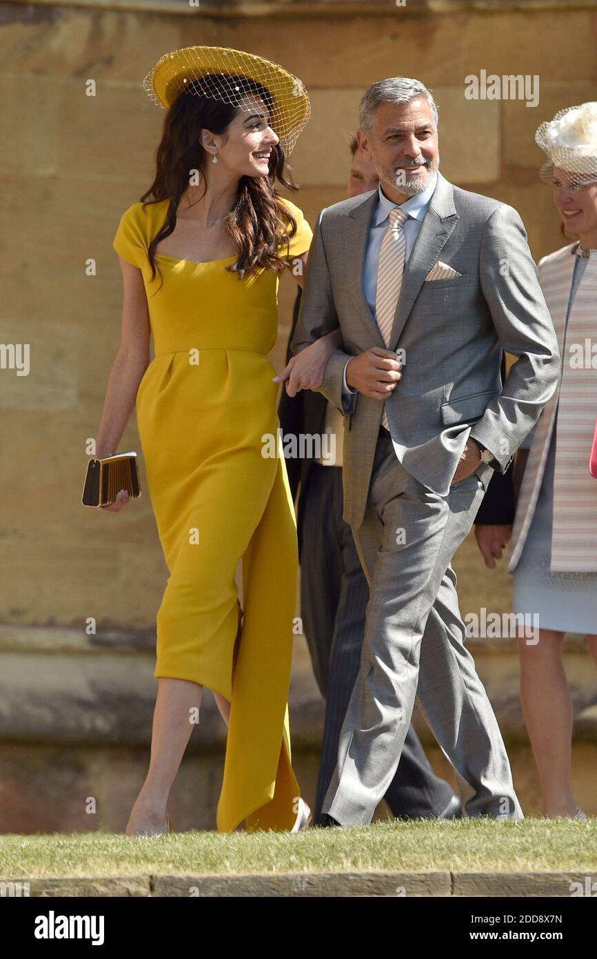 George Clooney and Amal Clooney attend the wedding ceremony of Prince Henry Charles Albert David of Wales marries Ms. Meghan Markle in a service at St George s Chapel inside the grounds of