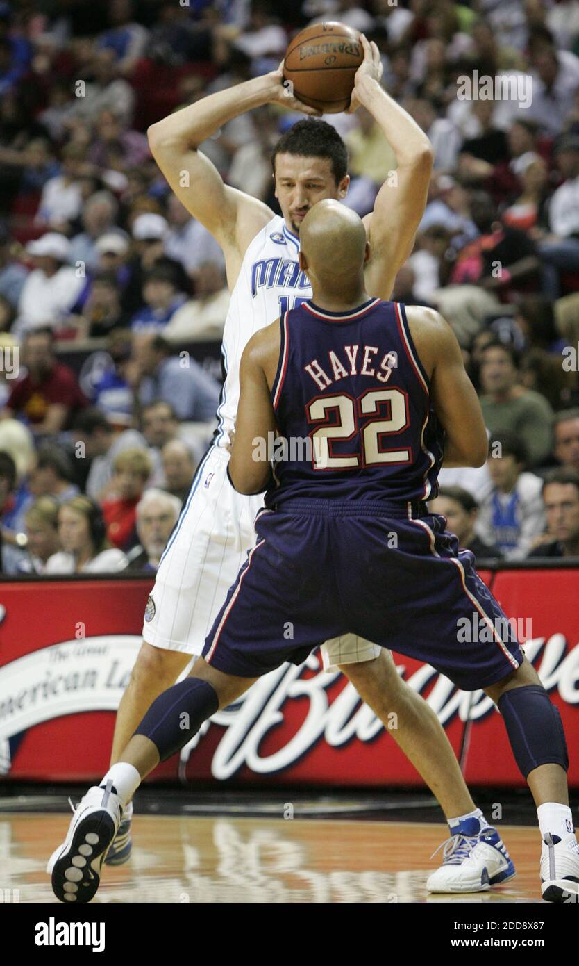 NO FILM, NO VIDEO, NO TV, NO DOCUMENTARY - Orlando Magic's Hedo Turkoglu  (15) tries to pass the ball past New Jersey Nets' Jarvis Hayes (22) on  Friday, March 6, 2009, during