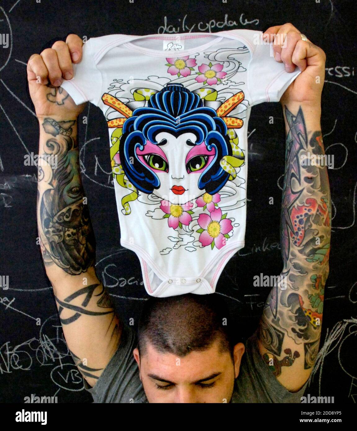 NO FILM, NO VIDEO, NO TV, NO DOCUMENTARY - Artists from the Love Hate Tattoo studio, best known from their star turn on 'Miami Ink' have designed onesies for babies. The artists are, from the front clockwise are Yoji Harada, Darren Brass, Miguel Paredes aka Mike Walls, James Hamilton, and Chris Garver, behind Yogi on right. Miami, FL, USA, February 25, 2009Photo by Marice Cohn Band/Miami Herald/MCT/ABACAPRESS.COM Stock Photo